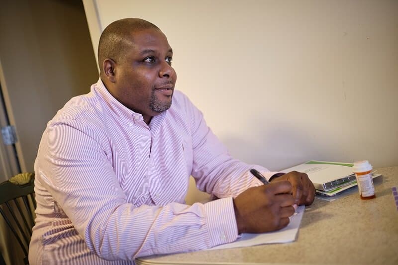 staff member with pen and paper